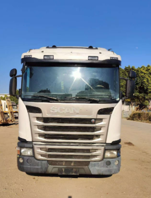 High quality used white Scania G410 4x2 tractor truck fitted with DC13 engine. Premium European heavy truck for long-distance container freight transport.