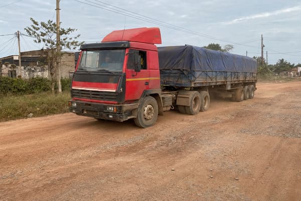 used tractor trailer on rough terrain road conditions