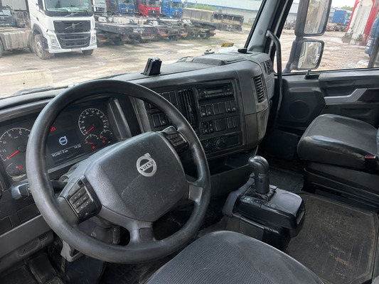 Inspecting the cab and mechanical condition of a used Volvo tractor