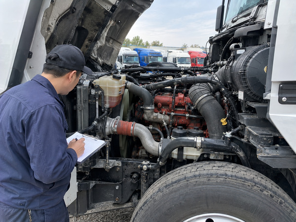 Checking the engine compartment of a used semi-truck