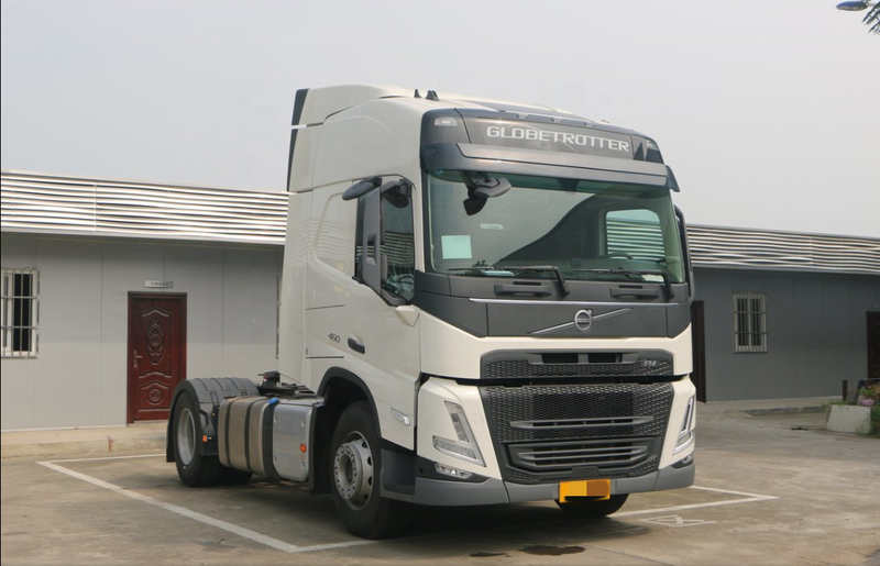 Used 6x2 FM460 for VOLVO tractor truck for sale good condition trailer truck head, 460HP heavy duty white tractor showing trailer coupling, left front side view
