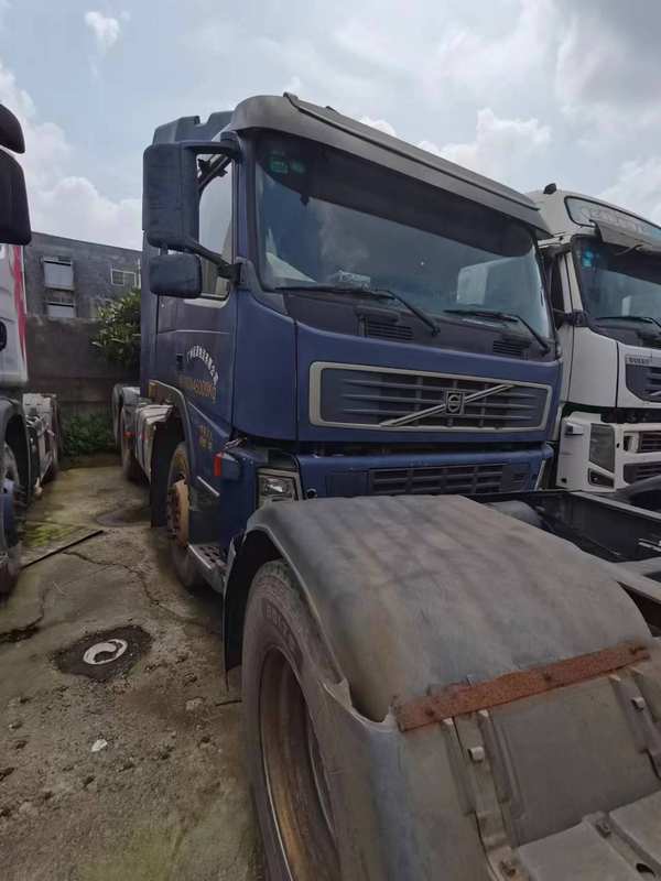 Used trucks best selling truck best price for Volvo FM400 6x2 for sale, 400HP heavy duty blue used truck, left front side view yard scene