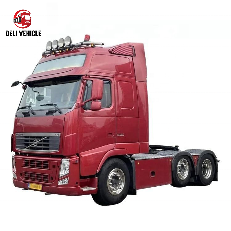 Left front angle view of second hand VOLVO FH500 6x2 used tractor truck, 500HP heavy duty used trailer truck with red cab