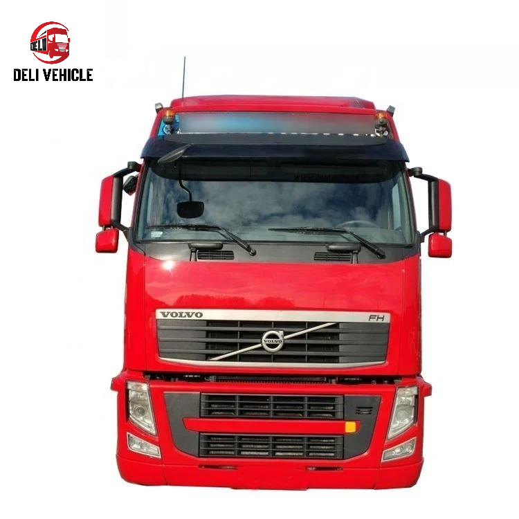 Front face view of second hand VOLVO FH460 6x2 used tractor truck, 460HP heavy duty used trailer truck with red cab and front grille