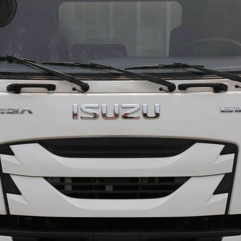 Close-up front view of Isuzu Giga 205HP 4x2 box truck cab, showing front grille and headlight, good condition used van cargo truck