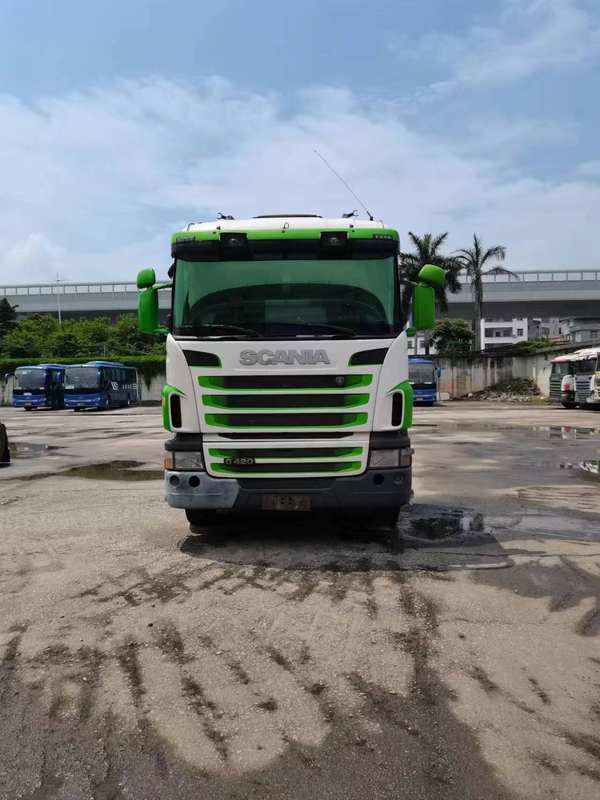 Used SCANIA G420 6x2 heavy tractor truck front face view, outdoor road scene with strong performance diesel engine