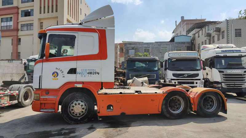 Durable used SCANIA G380 6x2 drive heavy dump truck, full left side view in industrial storage yard scene