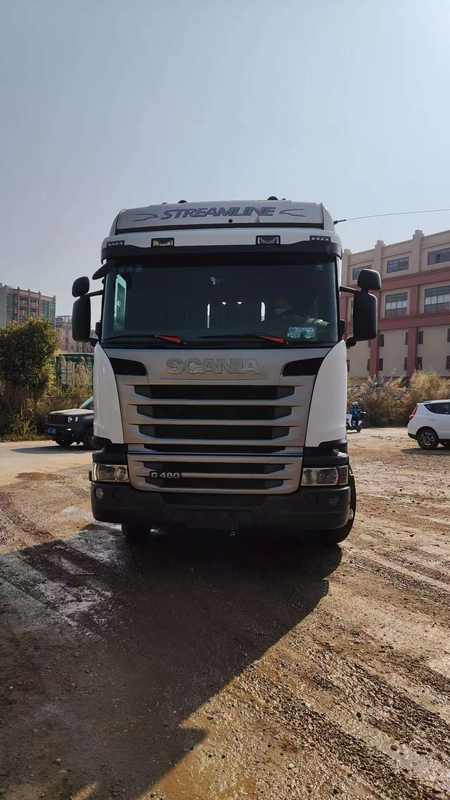 Second-hand SCANIA G480 6X2 heavy truck front face view, outdoor road scene with long-distance perspective