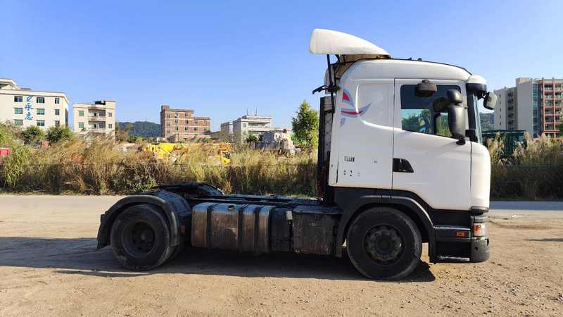 Second-hand SCANIA G410 4x2 heavy truck left front 45 degree view, outdoor roadside scene with natural light