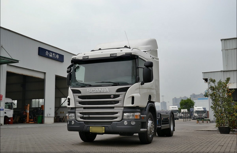 - Low price truck tractor used trailer truck head SCANIA P360 4x2 tractor truck head, 360HP heavy duty white tractor, left front 45 degree view outdoor storage yard