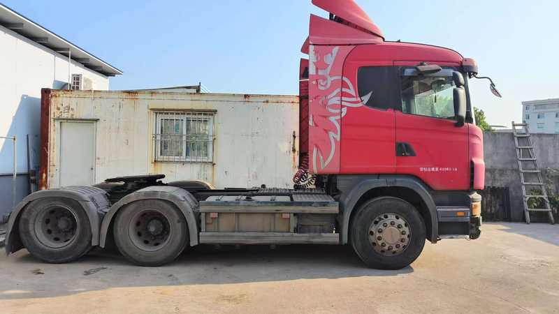 Cheap price 6x2 good condition wheel truck G380 for sale tractor used for scania truck, 380HP heavy duty red tractor, full left side view outdoor storage yard