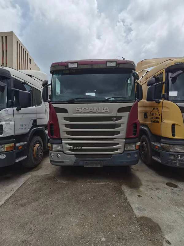 Scania commercial vehicle G series heavy truck 420hp 6x2 truck, 420HP heavy duty tractor front face view, outdoor storage yard with other truck units