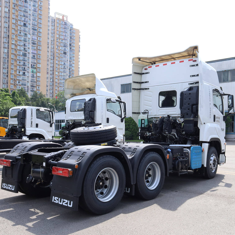 Left rear side view of second hand Isuzu VC61 460hp tractor truck, showing rear chassis and axles