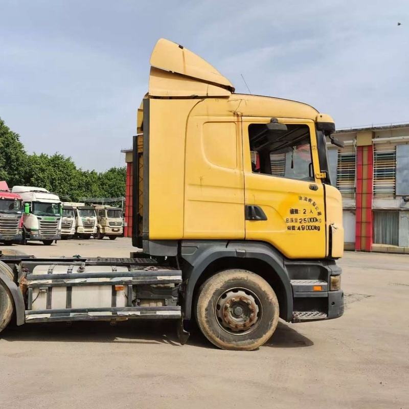 Second-hand SCANIA G420 6x2 yellow heavy duty tow truck, full left side view showing chassis frame and fuel tanks