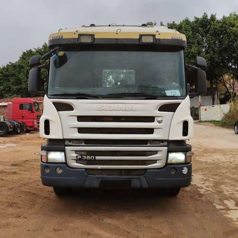 Used SCANIA P380 6x2 heavy duty tractor truck front face view, outdoor storage yard scene with natural light