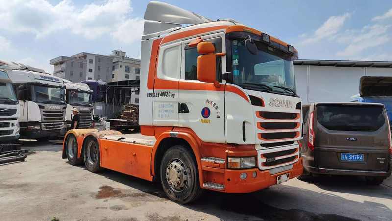 Low price used SCANIA G380 heavy duty dump tipper truck, right front 45 degree view outdoor construction site scene
