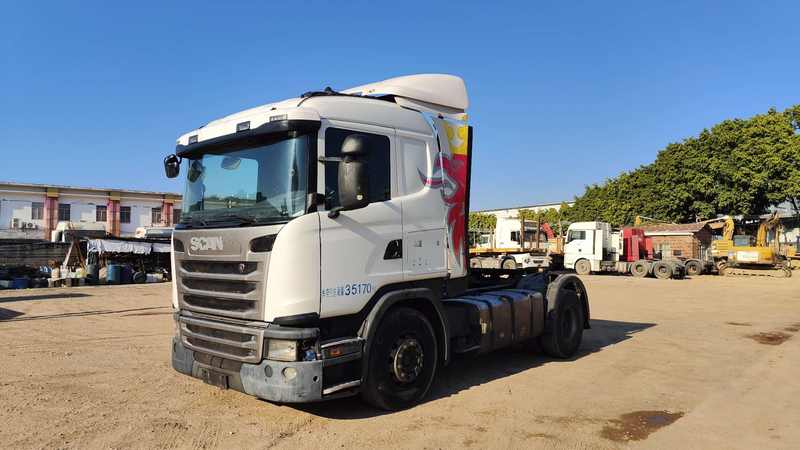 Good performance used SCANIA G410 4x2 heavy truck, right front 45 degree view in industrial storage yard