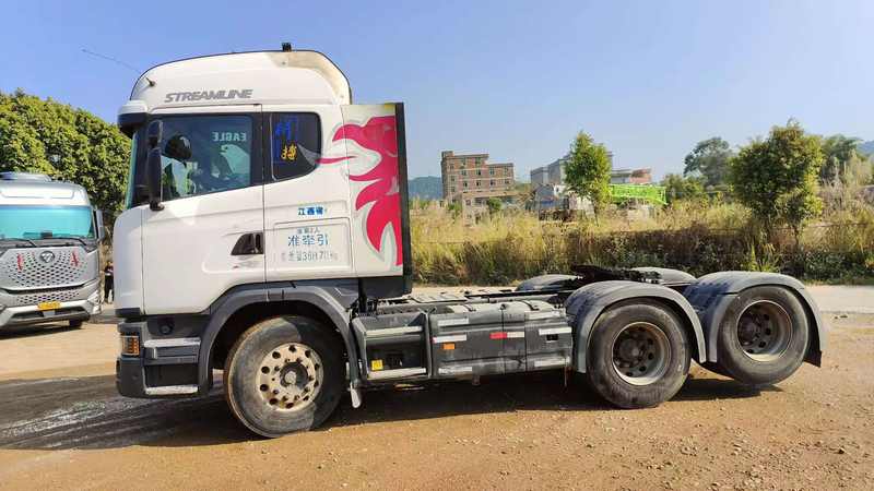 Used SCANIA G480 heavy duty truck trailer head, full right side view outdoor roadside natural scene