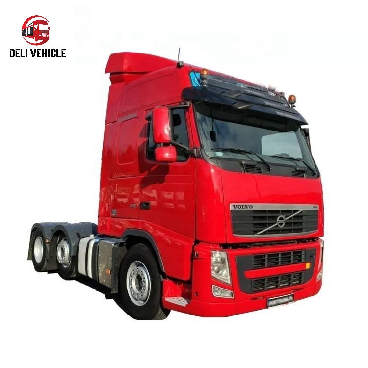 Left front angle view of second hand VOLVO FH460 6x2 used tractor truck, 460HP heavy duty used trailer truck with red cab