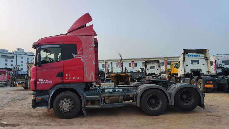 Cheap price 6x2 good condition wheel truck G380 for sale tractor used for scania truck, 380HP heavy duty red tractor, full left side view outdoor road scene