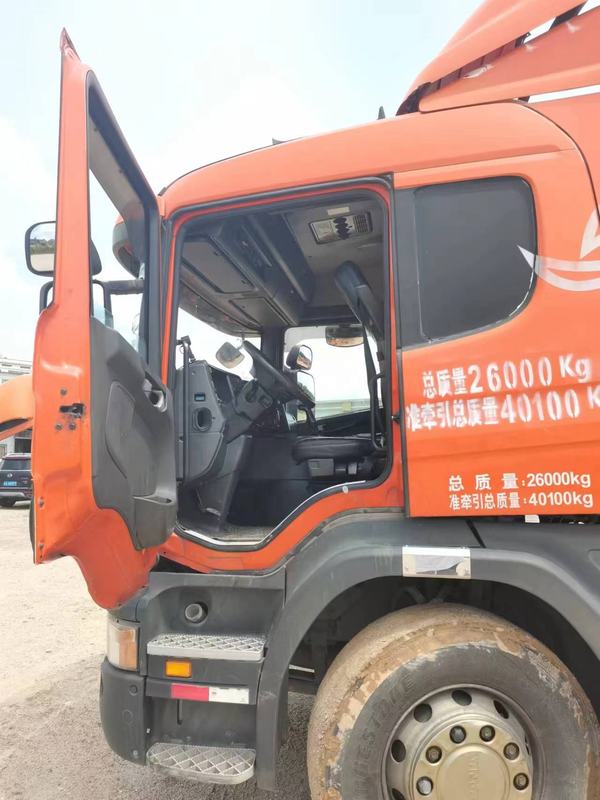 Used trailer truck head for SCANIA P380 sale high quality 6x2 tractor truck head, 380HP heavy duty tractor with open driver door, left side view showing cab entry
