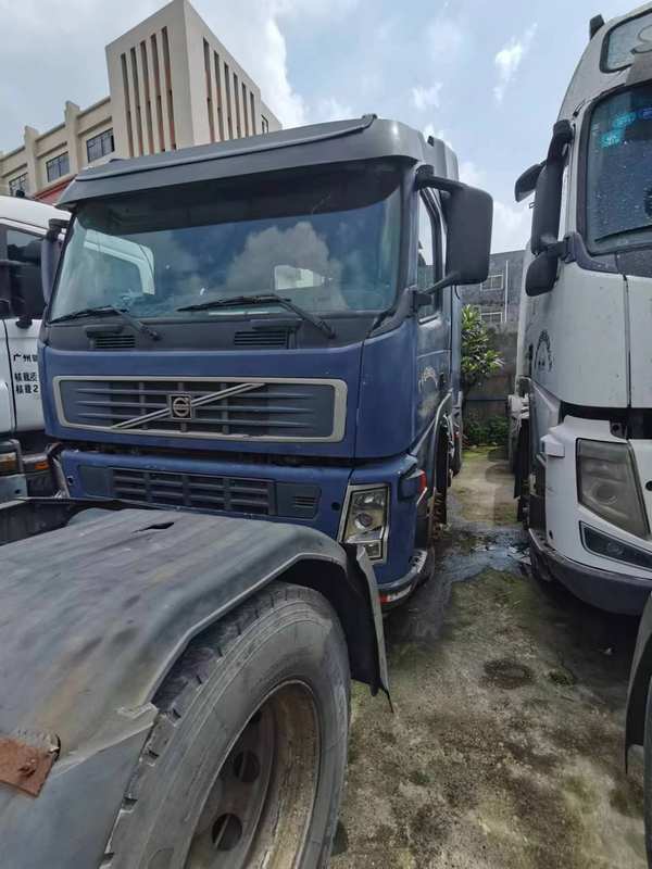 Used trucks best selling truck best price for Volvo FM400 6x2 for sale, 400HP heavy duty blue used truck, right front side view depot scene
