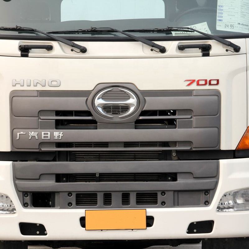 Close-up front view of Hino 700 Series truck grille, 2018 used 380HP 4x2 manual transmission heavy cargo tow tractor