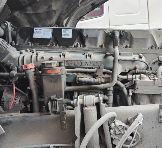 Second-hand tractor truck FM440 6x2 red for VOLVO high performance truck on hot sale, 440HP tractor showing engine compartment interior condition, well maintained engine close-up view