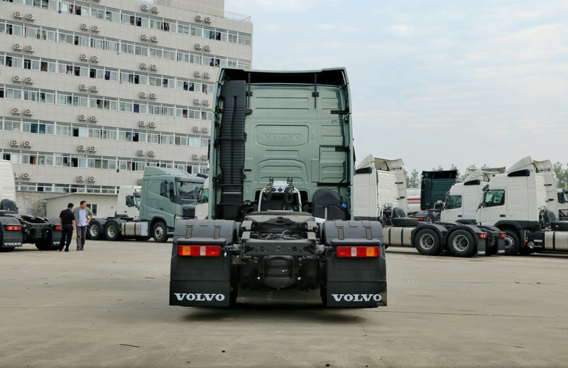 Second hand VOLVO FH500 6X2 tractor truck good condition trailer truck head for sale, 500HP heavy duty tractor showing rear bumper and lights, rear view outdoor parking lot