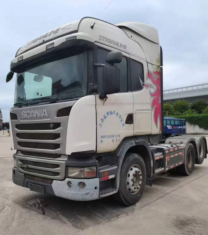 Used SCANIA G440 6x2 tractor truck left front 45 degree view, white heavy duty second-hand tractor, outdoor yard scene