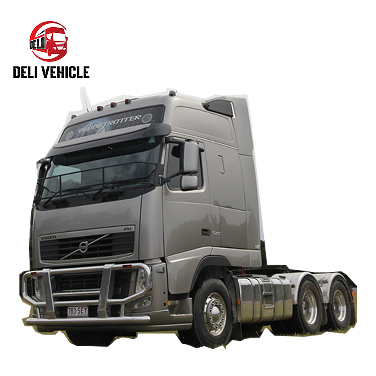 Left front angle view of high quality Volvo FH580 6*2 used truck, 580HP second hand trailer with silver grey cab tractor head