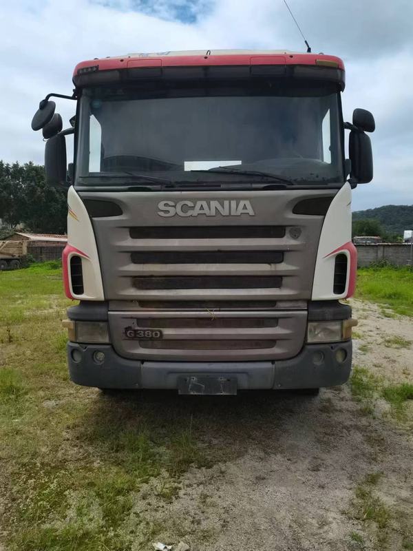 Used for scania G380 G420 G440 G450HP P380 tractor head hot sale manual gearbox left hand steering china 6x4 cheap used truck, heavy duty tractor with red brown cab, front view outdoor yard scene