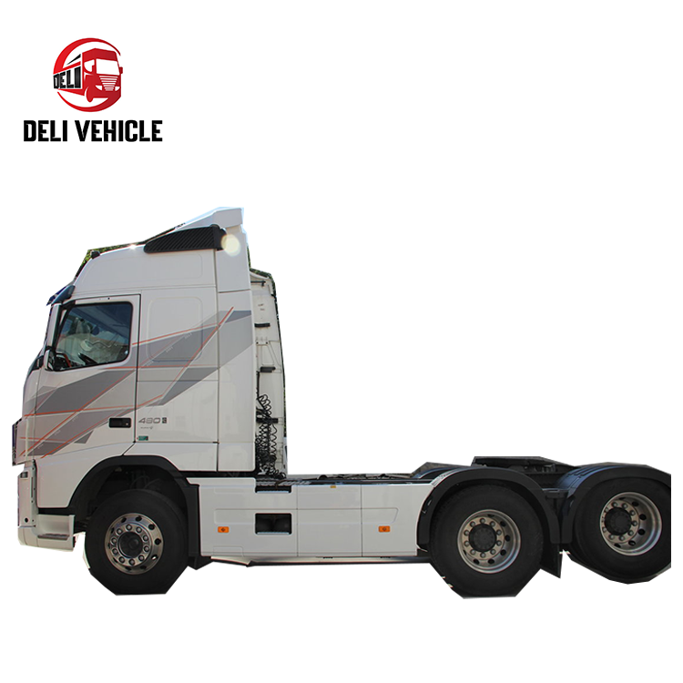 Full left side view of high quality Volvo FH480 6*2 used truck, 480HP second hand trailer with white cab heavy duty tractor