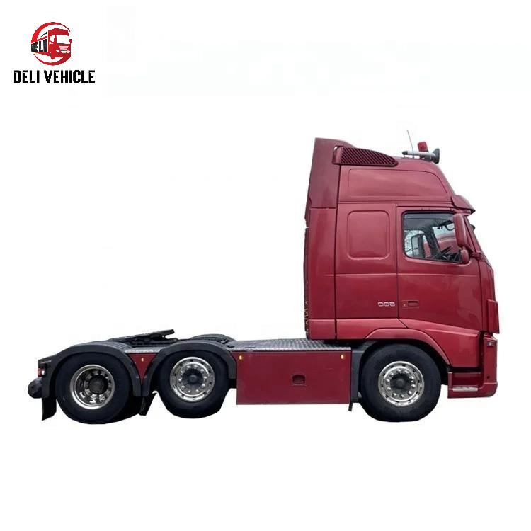 Right side view of second hand used trailer truck for VOLVO FH500 6x2 used tractor truck, 500HP heavy duty red tractor head