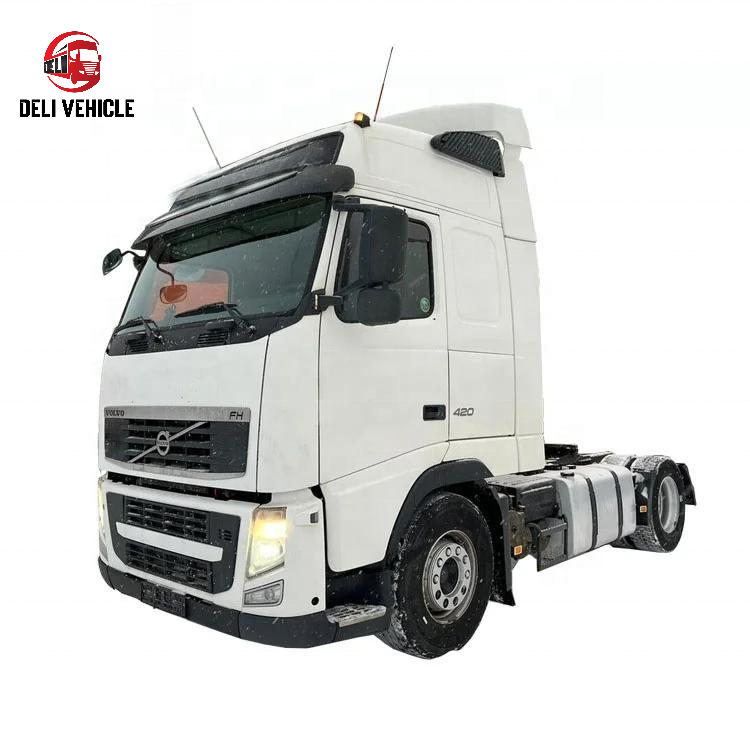 Right front side view of second hand used trailer truck for VOLVO FH420 4x2 used tractor truck, 420HP heavy duty tractor head with white high roof cab