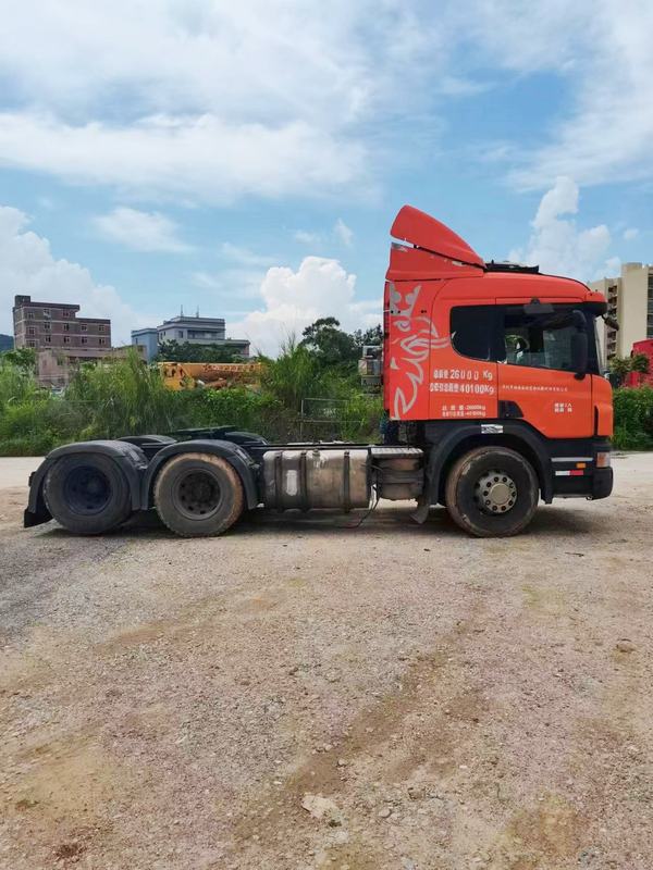 - Used trailer truck head for SCANIA P380 sale high quality 6x2 tractor truck head, 380HP heavy duty orange tractor, full right side view outdoor field scene