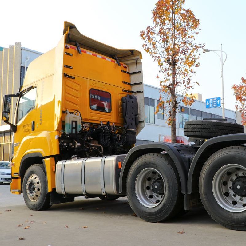 Right side wheel detail view of yellow used Isuzu GIGA Vc66 460hp 6x4 heavy tractor truck
