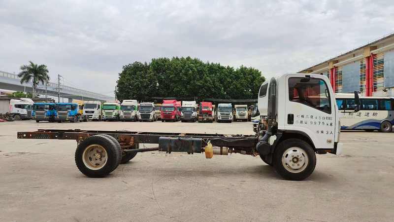 Left side view of used Isuzu 700P 4x2 right hand drive diesel cargo chassis truck