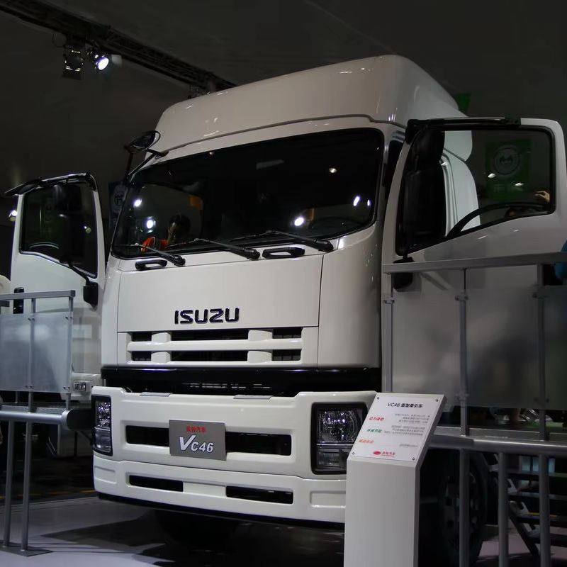 Left front side view of Isuzu VC46 350HP 6X4 heavy duty tractor truck with roof fairing panel