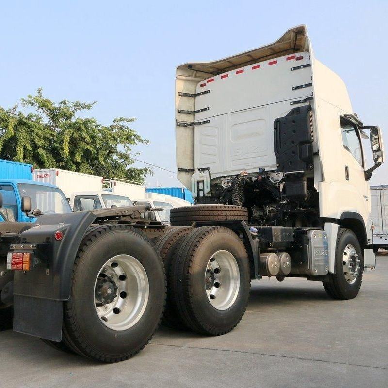 Front right side view of white 2022 used Isuzu GIGA 380hp 6x4 manual heavy duty tractor truck