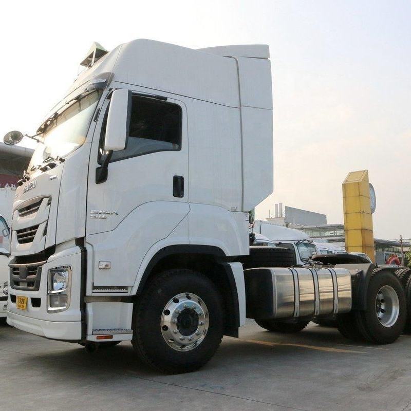 Front right side view of white 2022 used Isuzu GIGA 380hp 6x4 manual heavy duty tractor truck