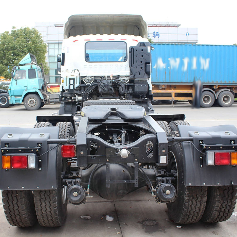Rear view of Isuzu VC46 6x4 used heavy tractor truck, showing rear axles and chassis