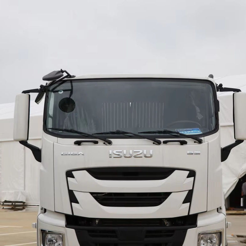 Close-up front view of Isuzu Giga heavy duty truck cab, showing front grille and headlight assembly