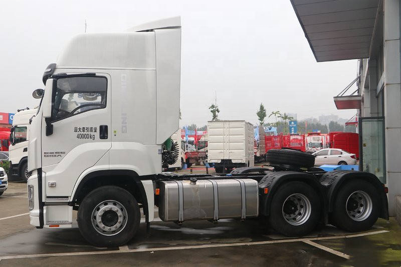 Left side view of white used Isuzu GIGA 420hp 6x4 manual heavy duty tractor truck