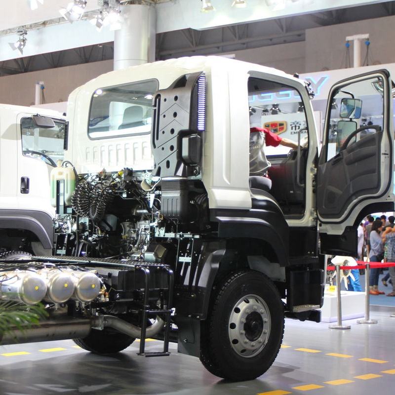 Right side view of Isuzu VC46 6x4 used tractor truck with cab door open, showing cabin access