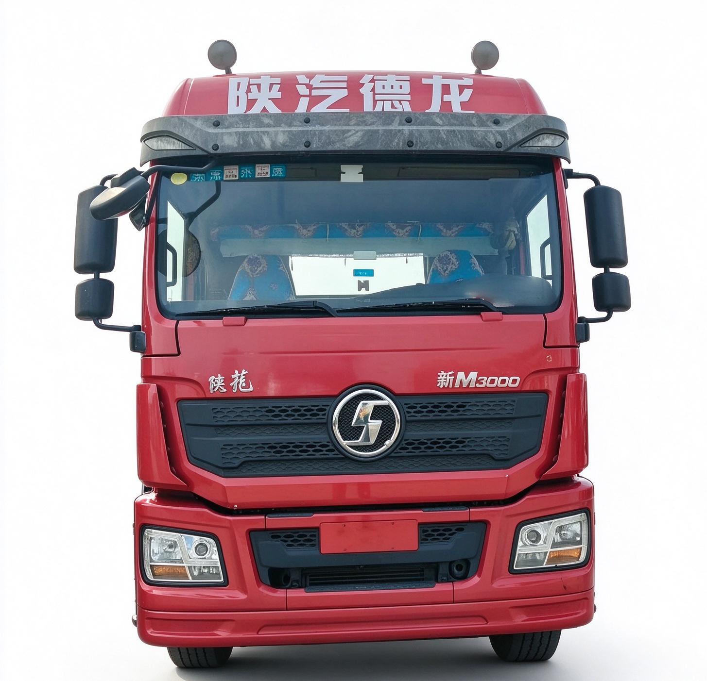 Close-up front view of red used Shacman M3000 6×4 Euro 5 heavy tractor truck